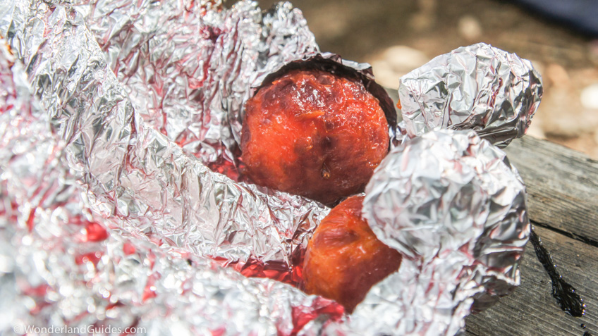 Roast plums wrapped in tin foil